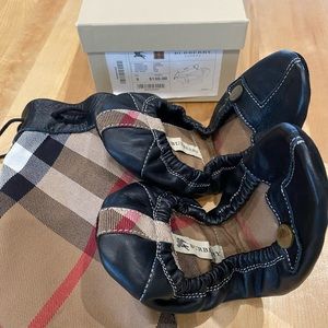 Burberry leather flats with travel bag.  Brand new in box.